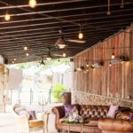 Elegant lounge area at Bull Run Winery featuring leather couches and rustic winery ambiance