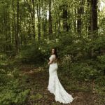 legant bride in her wedding gown photographed in the forest at Stone Manor Boutique Inn