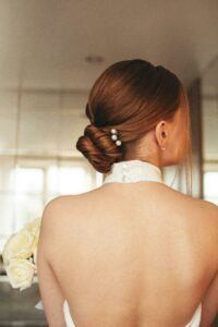 a photo of a sleek bridal bun hairstyle